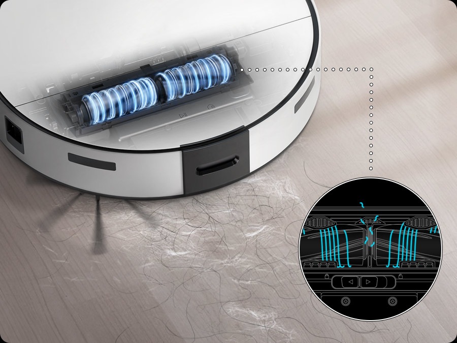 Jet Bot Combo Steam vacuums human and pet hairs with its brush. There is a close-up of the hair grinder inside cutting them into smaller pieces.