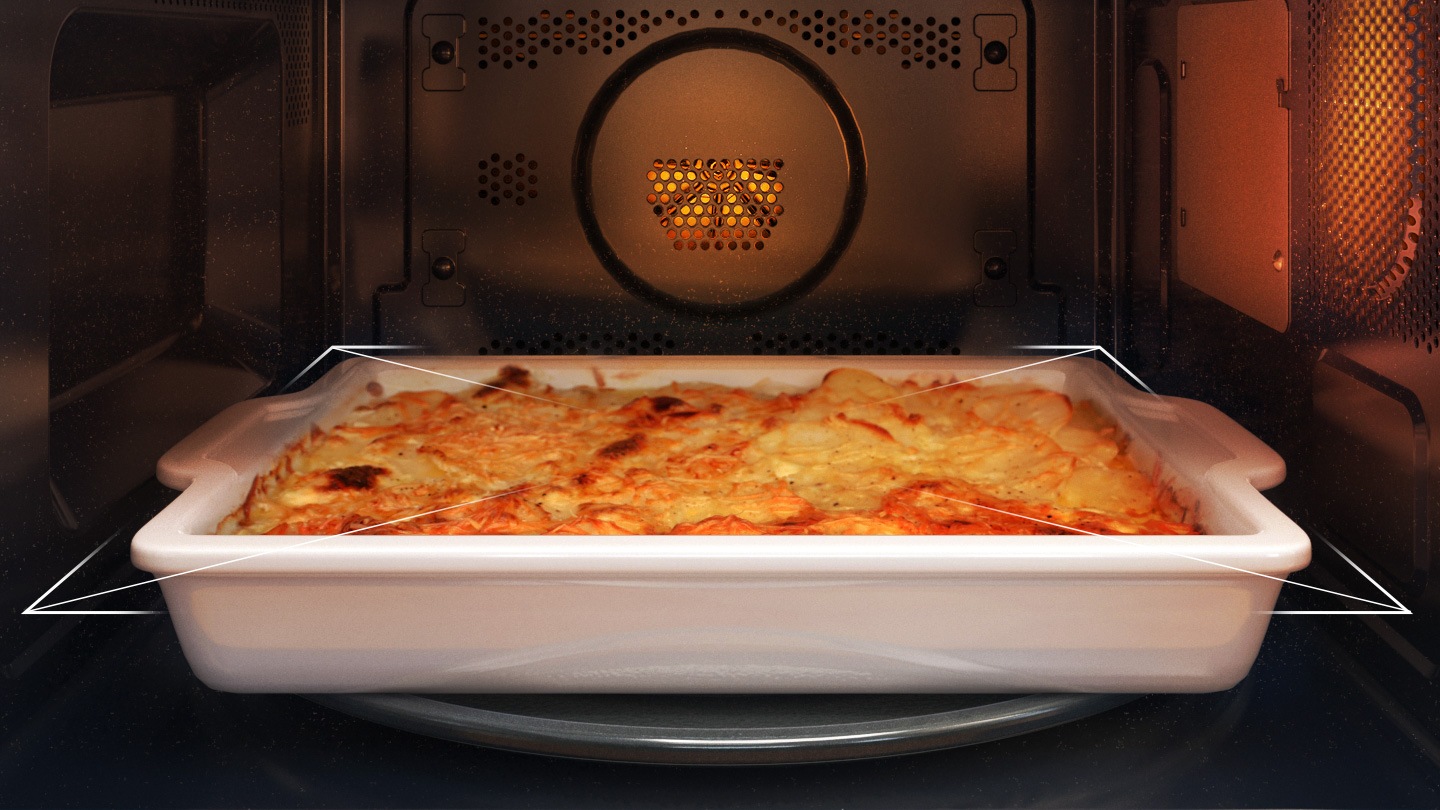 Shows the inside of the microwave oven with an oblong dish of gratin potatoes that is larger than the turntable. Arrows indicate that it is too close to the edge of the oven to rotate, so the turntable can be turned off while the dish is being cooked.