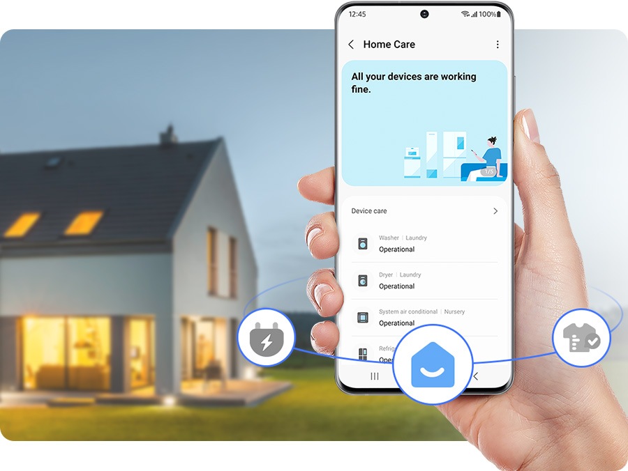 A hand holds a phone with the home care tab open from the SmartThings app on screen. There's an overview of different devices in the house including the washer, dryer, AC, and refrigerator. All the devices are working fine.