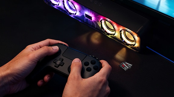 A hand playing a game on the console