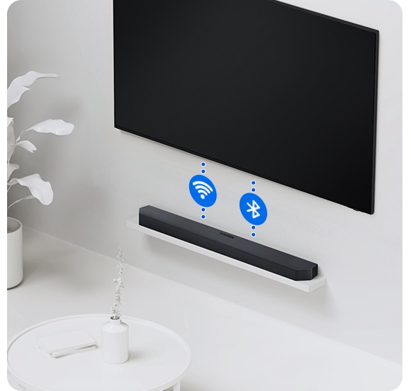 A TV and soundbar are connected wirelessly via dotted lines with the Wi-Fi and Bluetooth symbols.
