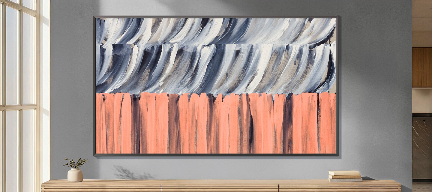 The Frame TV with Glare Free QLED displays lifelike abstract art with reduced reflections and consistent brightness in a modern interior.