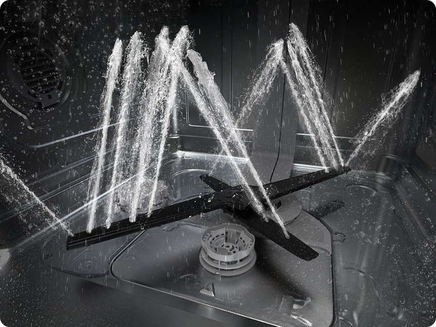 Shows the rotating dual wash arms of the WaterJet Clean™ system spraying powerful jets of water in multiple directions.