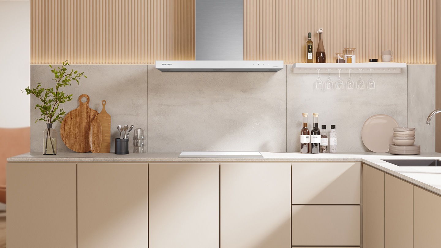The white glass hood is installed in the kitchen.