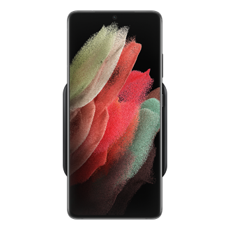 A top of a black Samsung wireless charger is charging a phone by harnessing up to 9W. See more and buy Samsung fast charger here