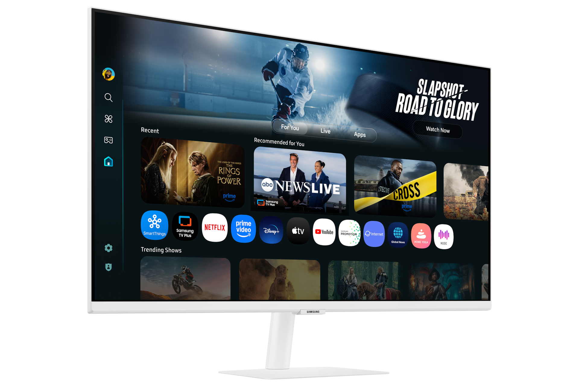 Front-left perspective of 32 inch Samsung Smart Monitor M7. Screen showing Smart TV Apps page with various content and apps lined up.