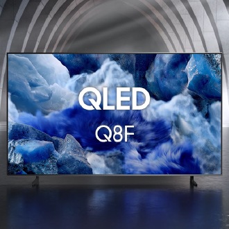 Samsung QLED Q8F TV in a black and white indoor space displays a colorful scene of an otherworldly landscape.