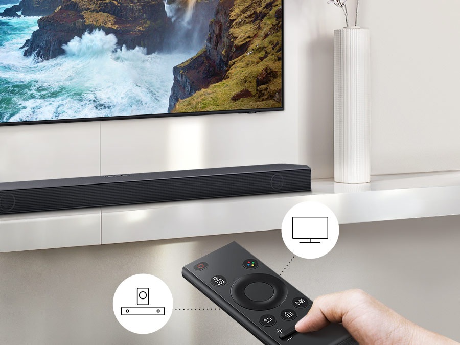 The user controls both Soundbar and TV functions with Samsung TV remote.