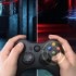 A scene in a game is on display while a person plays with the gaming console. 