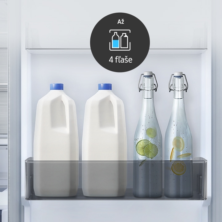 Two bottles of milk and two bottles of water are stuck in the RB7300 Big Door Bin. There is Up to 4 Pints icon.