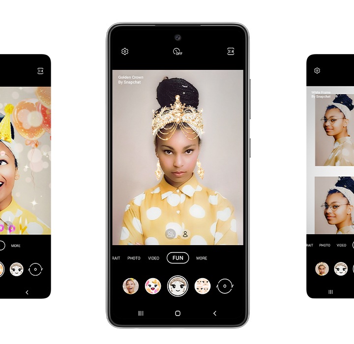 1. Galaxy A52s 5G seen from the front. On either side of the phone are four total representations of the screen. On each screen, the Fun mode option selected in the Camera app onscreen, and shows the five different lenses available. From left is Neon Body, Happy Birthday, Golden Crown, White Frame and Neon Frame. In the phone in the center we see a woman taking a selfie and using the Snapchat lens Golden Crown, which puts an ornate gold crown on the top of her head.