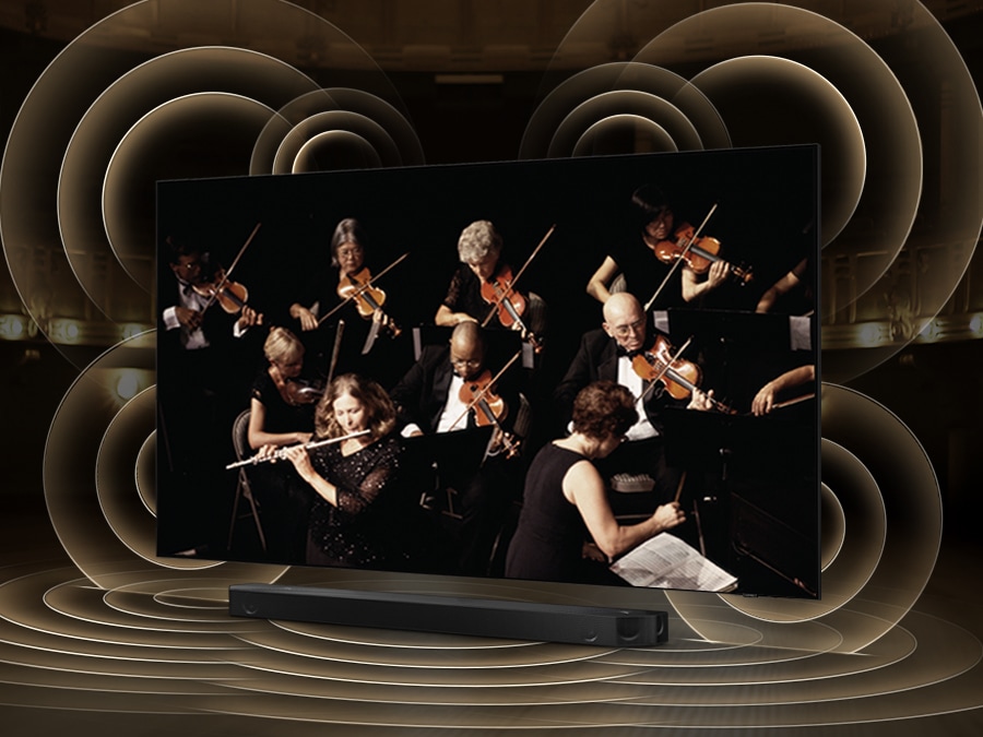 ภาพกราฟิกคลื่นเสียงจำลองจากทีวีและซาวด์บาร์แสดงให้เห็นเทคโนโลยี Q Symphony ขณะที่อุปกรณ์ทั้งสองอย่างนั้นเล่นเสียงคู่กัน