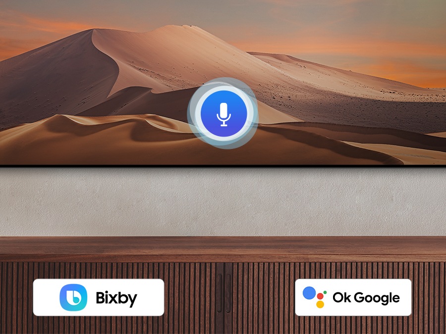 A microphone icon overlays an image, demonstrating voice assistant feature. The Bixby, Alexa built-in and the OK Google logos are on display on the bottom.