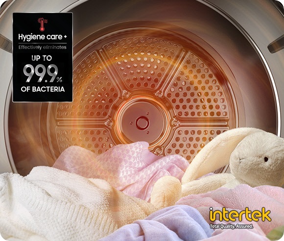 Several articles of clothing and a stuffed animal are inside a Samsung Bespoke Grande AI dryer, which is filled with steam. On the top left corner is a label with the text Hygiene care+ effectively eliminates up to 99.9% of bacteria. Intertek’s Total Quality Assurance certification is placed on the bottom right.
