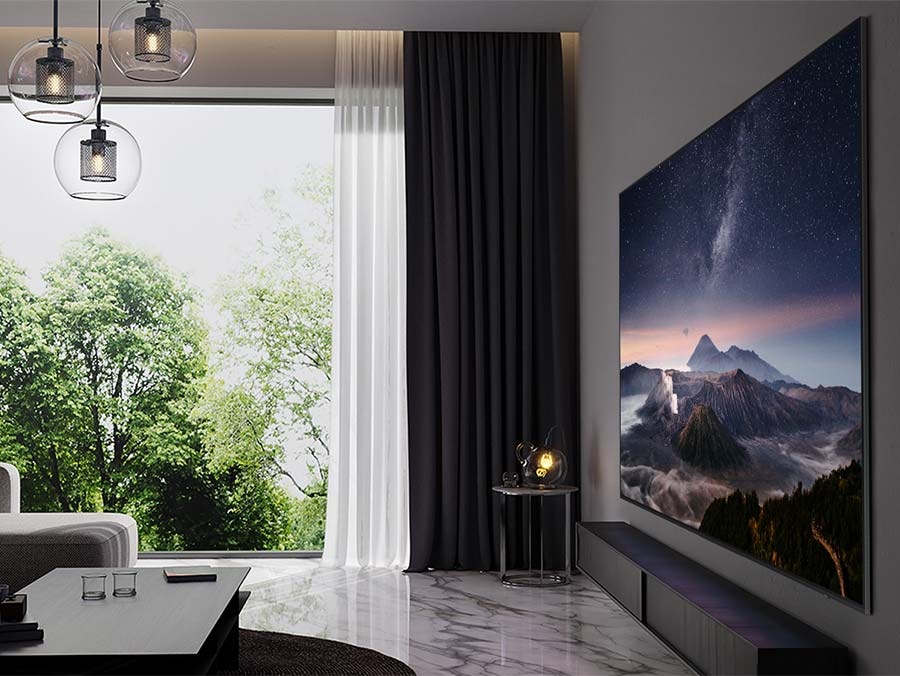 A 98 NEO QLED TV is mounted on the wall in a living room as it displays a mountain vista.