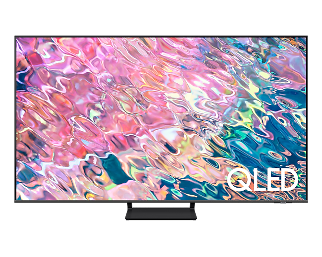 ดูราคาโทรทัศน์ Samsung QLED 65 นิ้ว สมาร์ททีวีดีไซน์สวยบางเฉียบ มอบภาพสีสวยระดับ 100% พร้อมเผยรายละเอียดที่โดดเด่นในทุก ๆ ฉาก. ด้านหน้าของ Q65B QLED 65 นิ้ว สี Gray พร้อมมีคำว่า QLED สีขาวระบุอยู่