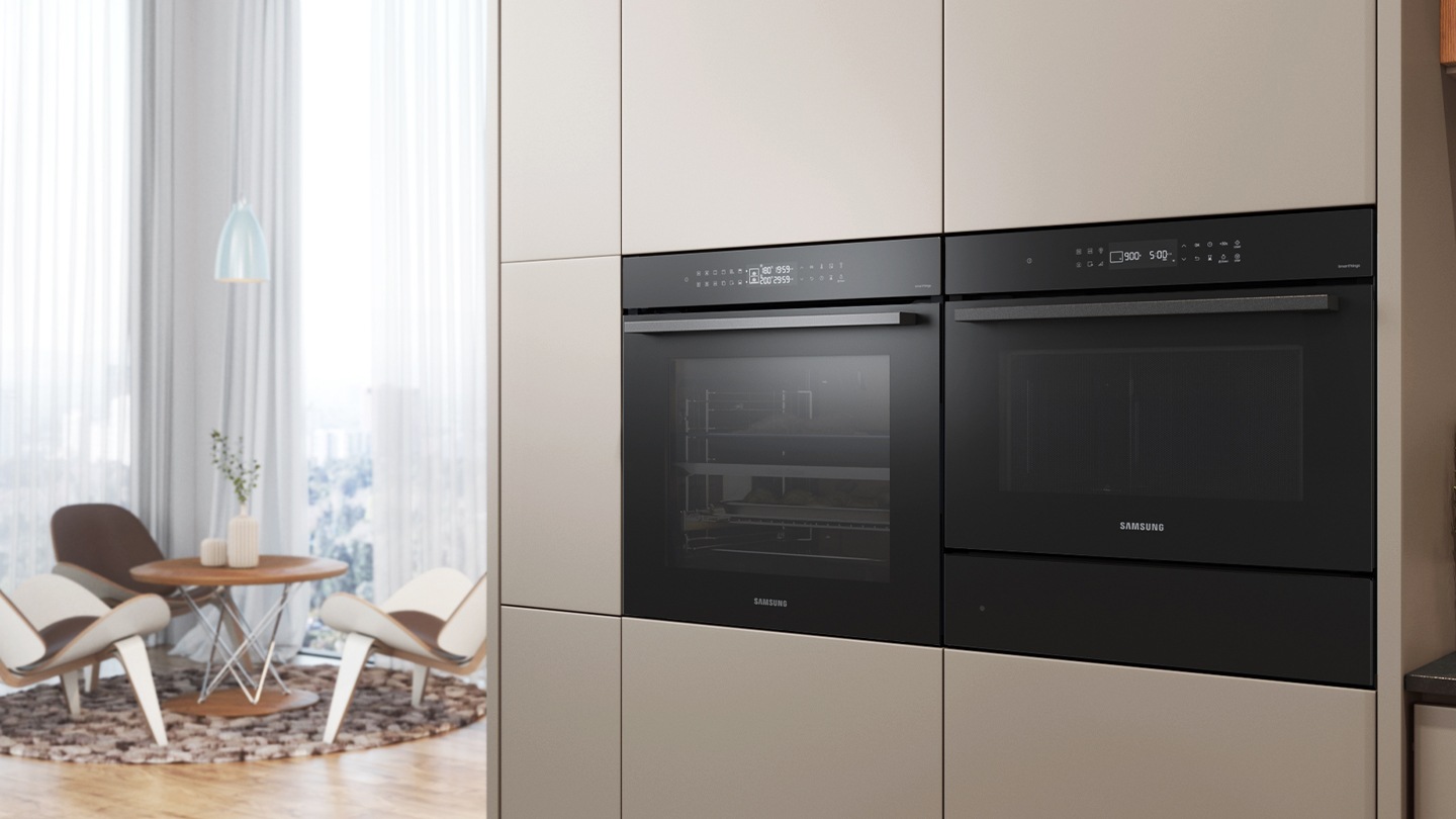 Shows the built-in oven installed in a kitchen, with two cooking zones and a hinged door, next to a Microwave Combi oven.