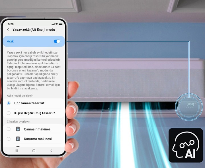 İç mekan ünitesine bir hat ile bağlı akıllı telefonun ekranında “Yapay Zeka Enerji Modu” ekranı gösteriliyor. Aşağıda ise yapay zeka işareti yer alıyor.