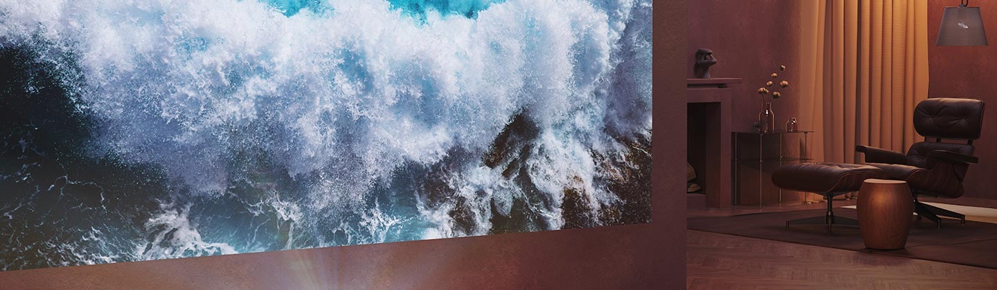 The Premiere projects an image of ocean waves onto the wall of a living room.