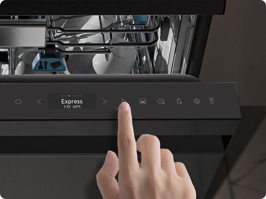 A close-up of the dishwasher control panel. A person presses the buttons.