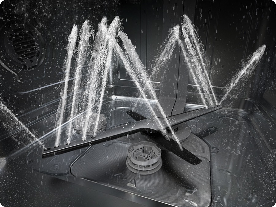 Shows the rotating dual wash arms of the WaterJet Clean™ system spraying powerful jets of water in multiple directions.