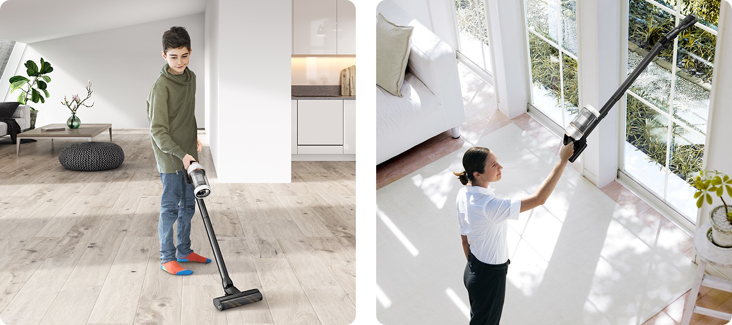 一個小男孩用 Bespoke JET 吸客廳，一個女人用 Bespoke JET 吸高窗台。