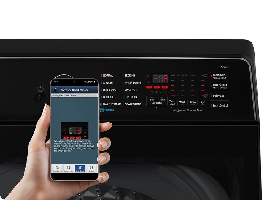 A person scans the error code that appeared on the washing machine display with the smartphone App.