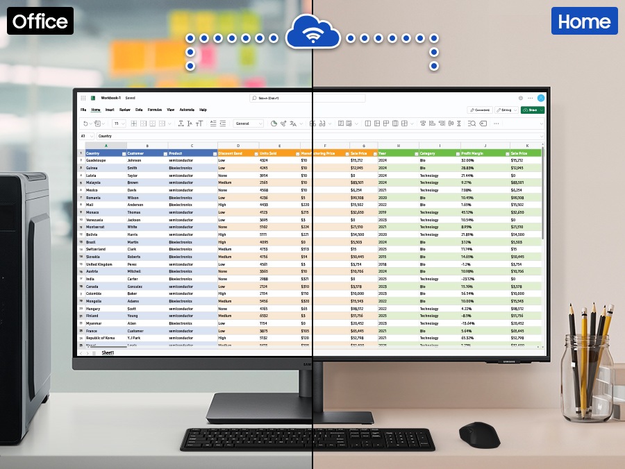 在辦公空間中的顯示器顯示一個包含大量資料的 Excel 檔案。這部顯示器透過 Wi-Fi 連接到家中的另一部顯示器，兩部顯示器都顯示相同的 Excel 檔案。