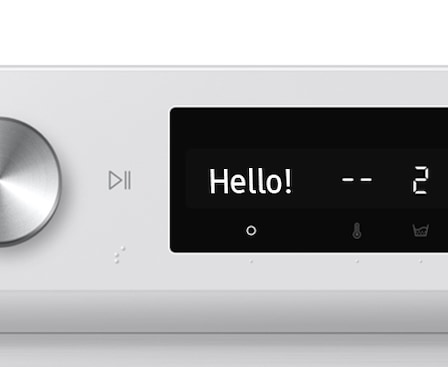 The AI washer's control panel отображает message “hello!”.