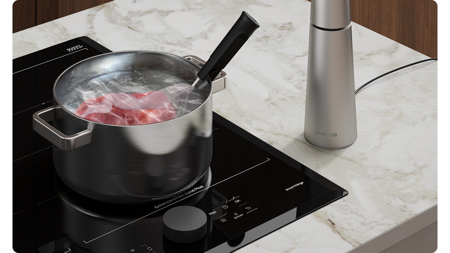 On the cooktop, the sous-vide meat is being cooked in the pot, and the Assist Sensor senses the temperature of food and automatically adjusts the optimal temperature from 27 degrees to 63 degrees. The graph shows that Assist Sensor controls the power level to maintain water temperature.