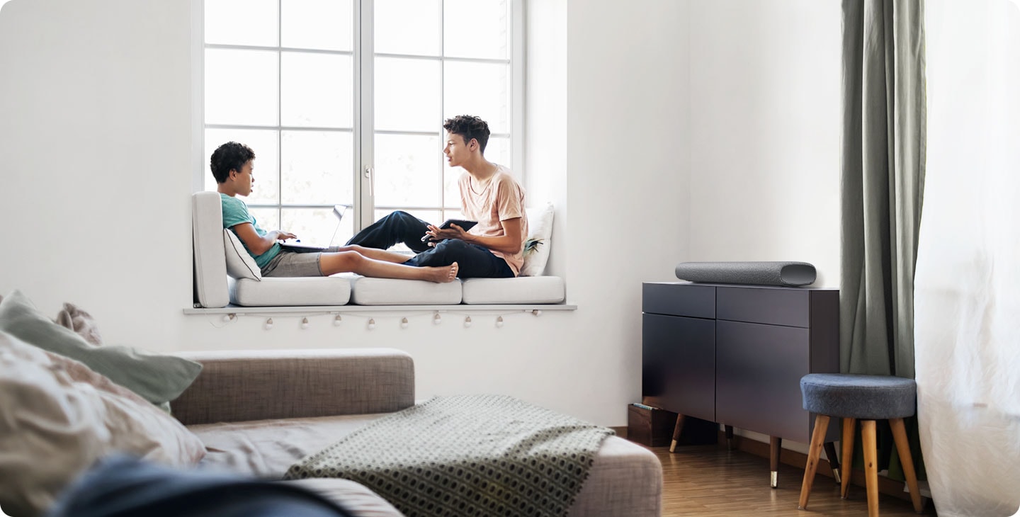 All-in-one design of S50A soundbar blends elegantly with bedroom room interior as two young kids relax together.