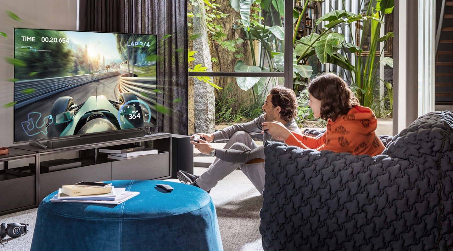 Two friends are enjoying an immersive gaming experience with Samsung Soundbar Game Mode Pro.