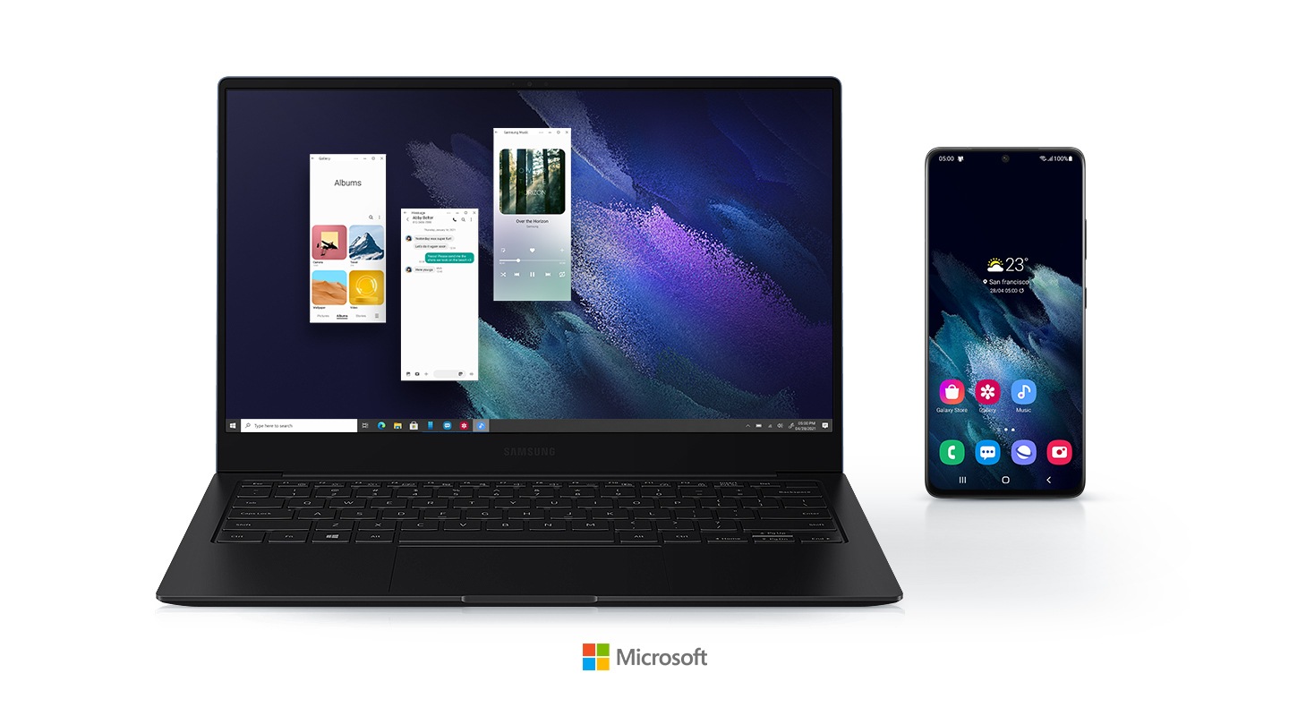Ba ứng dụng Android đang được chạy trên Galaxy Book Pro bằng cách sử dụng ứng dụng điện thoại của bạn. Một điện thoại di động được hiển thị ngay bên cạnh máy tính xách tay, cho thấy hai thiết bị được kết nối. Một logo của Microsoft được đặt bên dưới các thiết bị