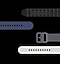 Five watch bands are flat and laid out horizontally in various colors from Black to Navy to Composite Gray to Sand Gray to Brick Red.