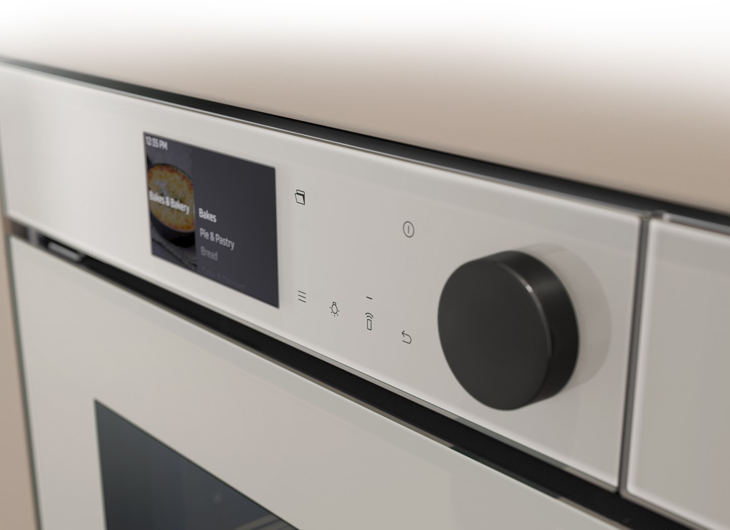 Shows a close-up of the oven's stylishly minimalist control panel with an LCD display, which shows pictures of the various cooking options, touch control and a single knob.