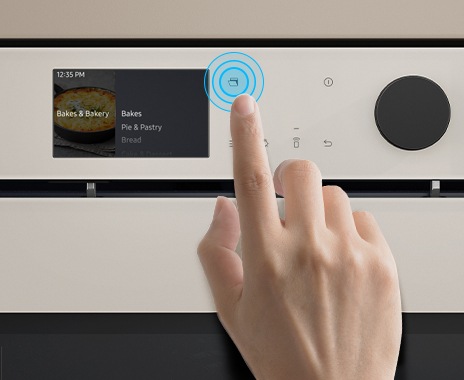 Shows a close-up of a hand touching the Auto Open Door button on the control panel.