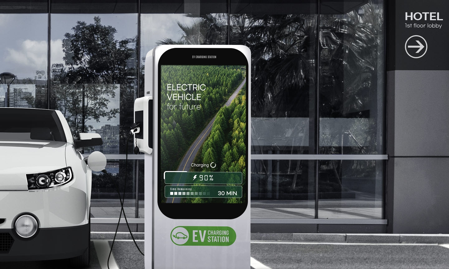 Electric vehicle chargers are installed in the hotel parking lot. On the screen of the electric vehicle charger, along with advertisements related to electric vehicles, it is indicated that 30 minutes remain until charging is complete and that it is 90%