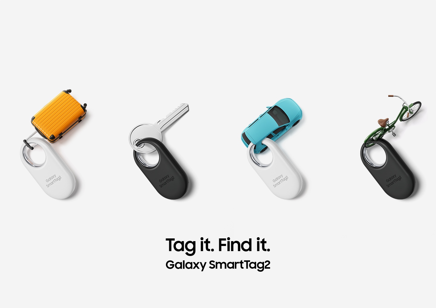Four Galaxy SmartTag2 devices, two in white and two in black, are neatly placed. The devices are tagged to the following items: A miniature suitcase, a key, a miniature car, and a miniature bicycle.
