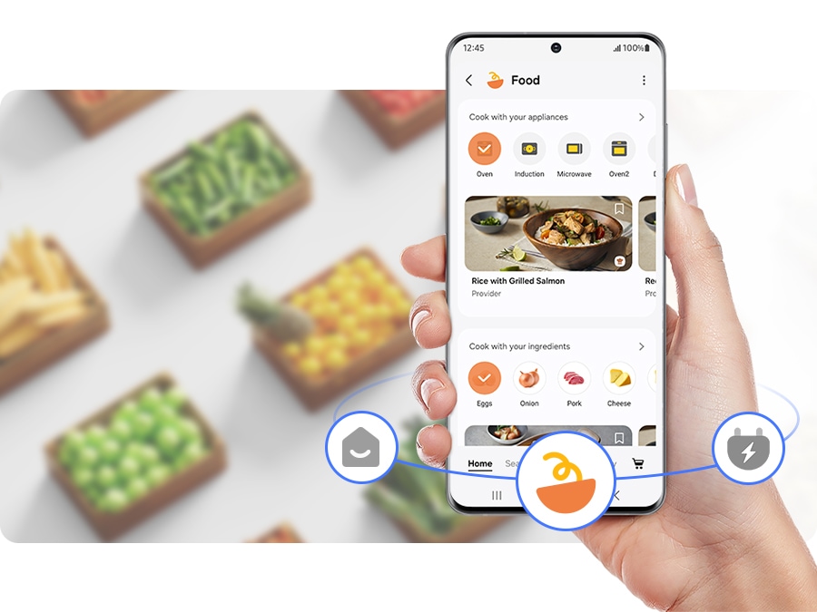 Egy személy a SmartThings mobilalkalmazást használja főzéshez.