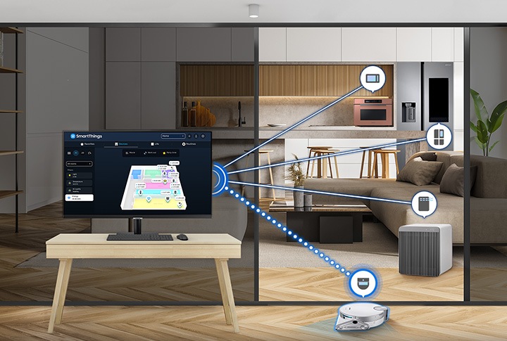 There is a monitor in a room with a vacuum cleaner, and outside of the room, a kitchen and living room is shown. In the kitchen, there is a cooker and a refrigerator. And there is an air purifier in the living room. All the devices are connected with the Smart Monitor with SmartThings, and the vacuum cleaner is activated by the SmartThings hub on the monitor.