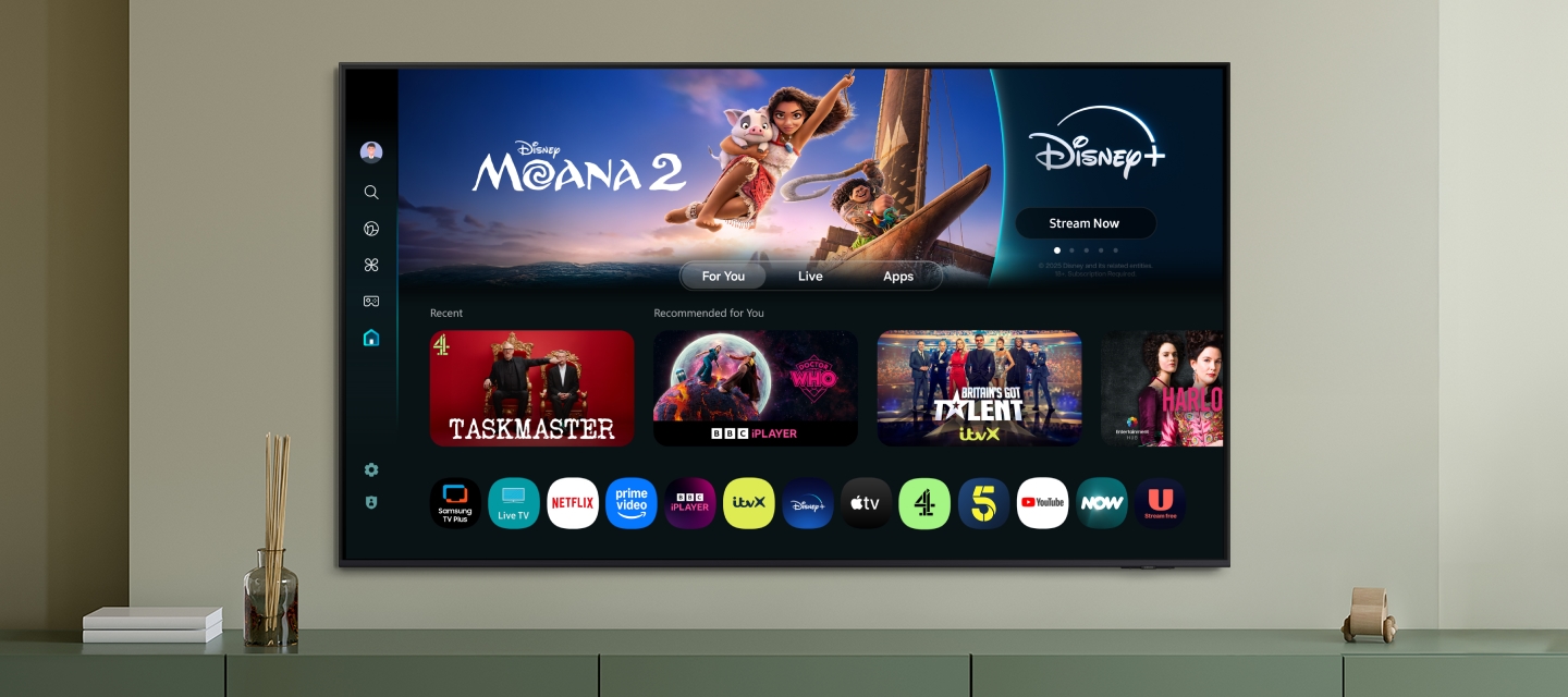 One UI Tizen’s home screen, with the various apps and services available, is displayed on a TV in a living room.