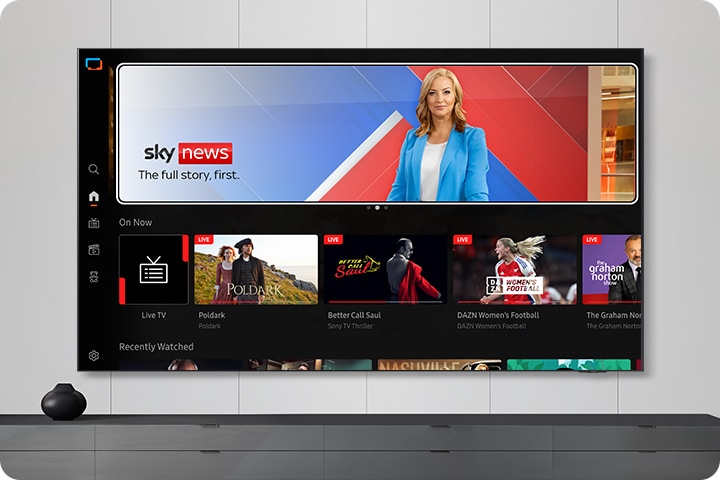 TV in a living room shows Samsung TV Plus home screen and the diverse TV channels available with it.