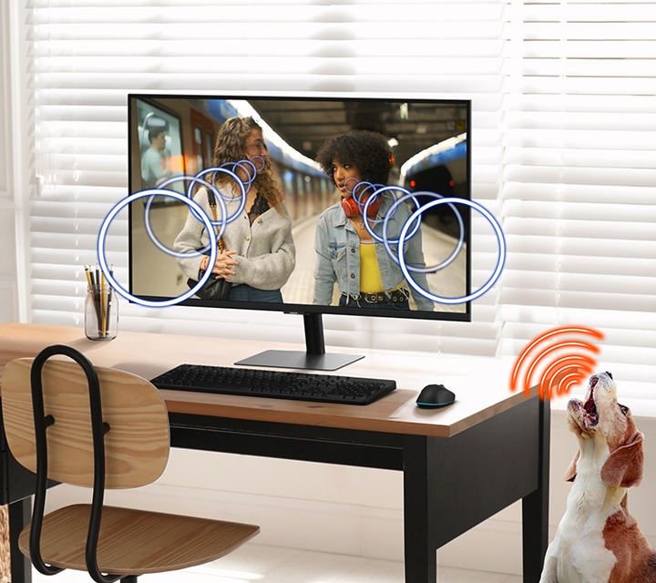 A modern monitor setup and a dog. Active Voice Amplifier enhances Dialogue sound when the dog barks.
