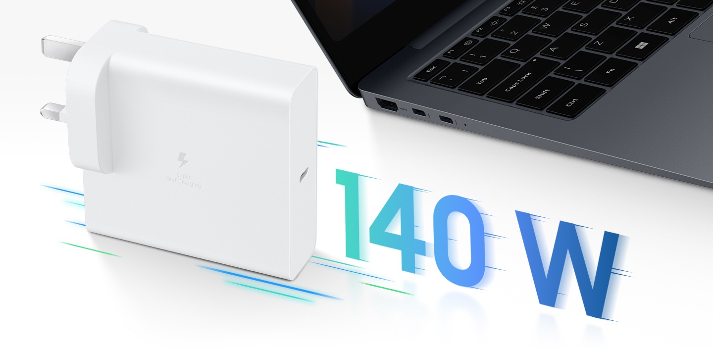 A white 140 W Power Adapter is positioned sideways next to a Galaxy Book Ultra as if moving forward with blue-green streaks around it and text '140 W'. Text on the Power Adapter reads 'Super Fast Charging'.