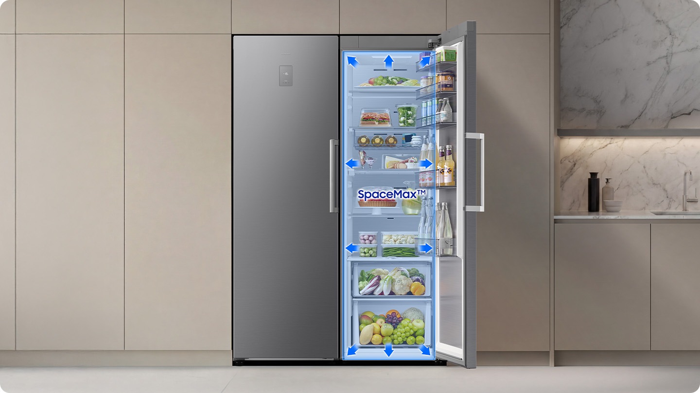 The door of the refrigerator is open. Arrows indicate increased internal space, enabled by SpaceMax™ technology.