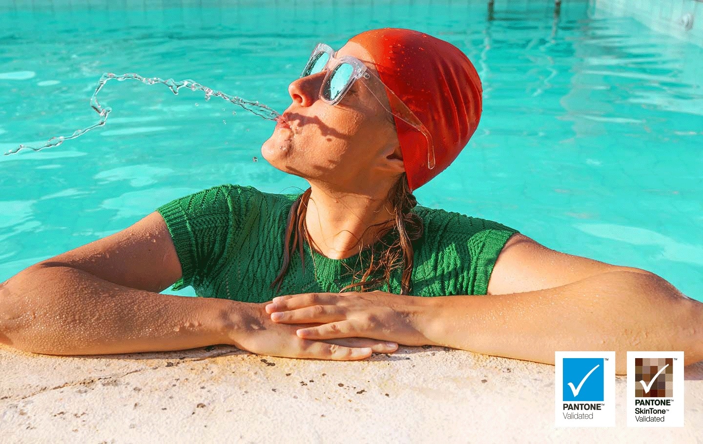 A woman is spitting out water in the pool. All the colors in the image become vivid as the brightness level increases. VDE tested logo is on display.