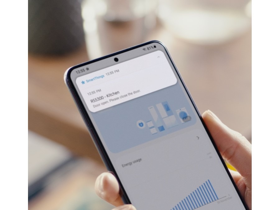 Person using smart phone to use SmartThings app