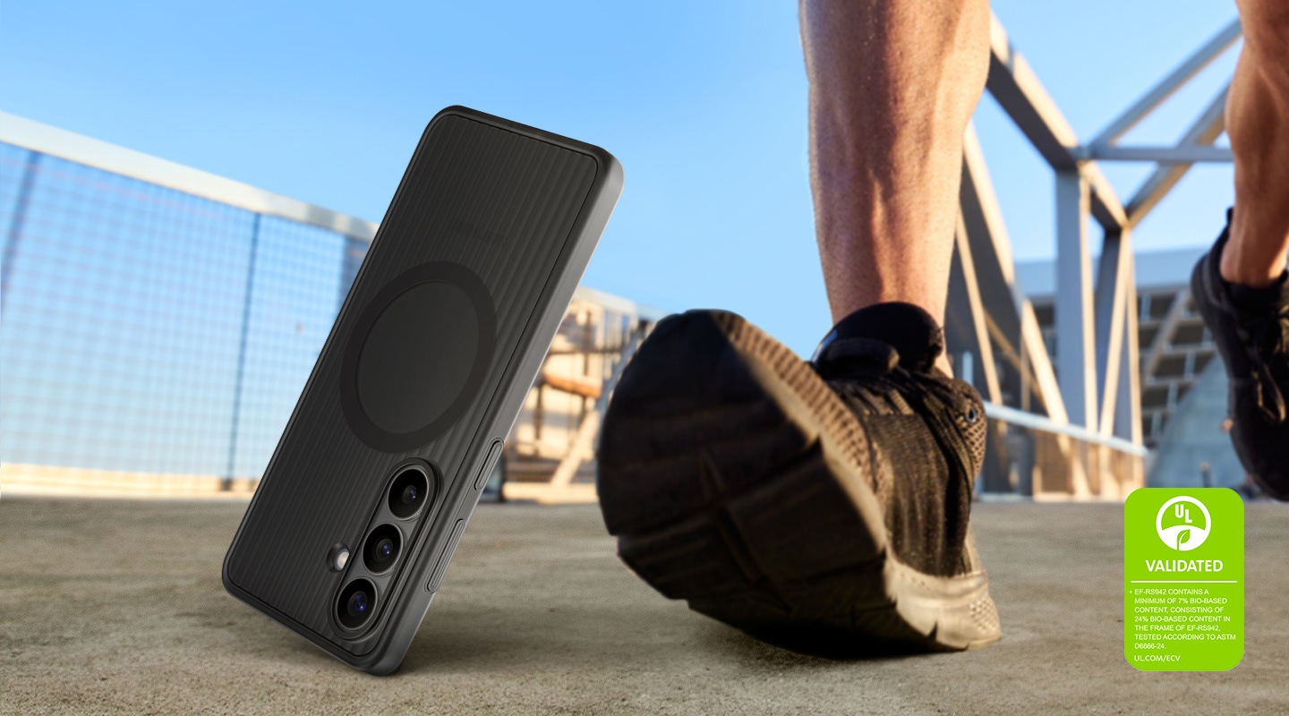 A Galaxy S26 in a Black Rugged Magnet Case is falling on the ground besides a person's step, highlighting the case's durability and readiness for outdoor use. A UL Environmental Claim Validation Mark is shown 'UL VALIDATED. EF-RS942 CONTAINS A MINIMUM OF 7% BIO-BASED CONTENT, CONSISTING OF 24% BIO-BASED CONTENT IN THE FRAME OF EF-RS942, TESTED ACCORDING TO ASTM D6866-24. UL.COM/ECV'.