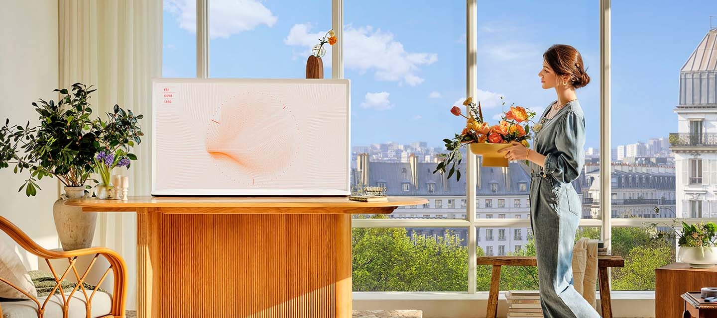 The Serif is mounted on a stand. Then The Serif is placed on a table without the stand. Then the backside of The Serif, which is mounted on a stand, is on display demonstrating its 360 All Around Design.
