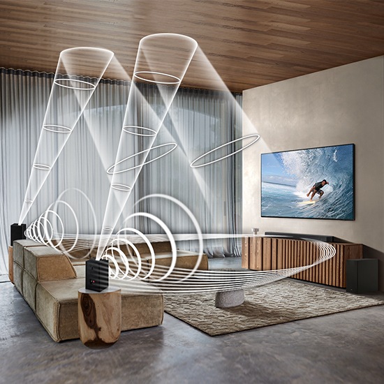 Soundwave graphics are playing from Samsung Wireless Rear Speaker Kit and Soundbar, demonstrating Wireless Surround Sound Compatibile feature of Samsung soundbar.